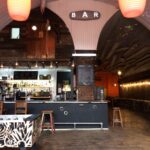 Versatile warehouse bar arches space